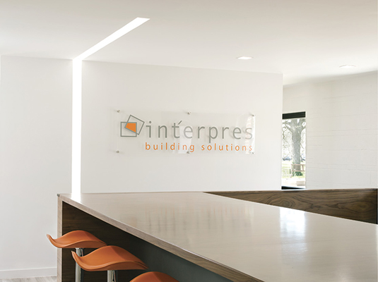 Modern commercial office with downlights and recessed continuous in a corner application